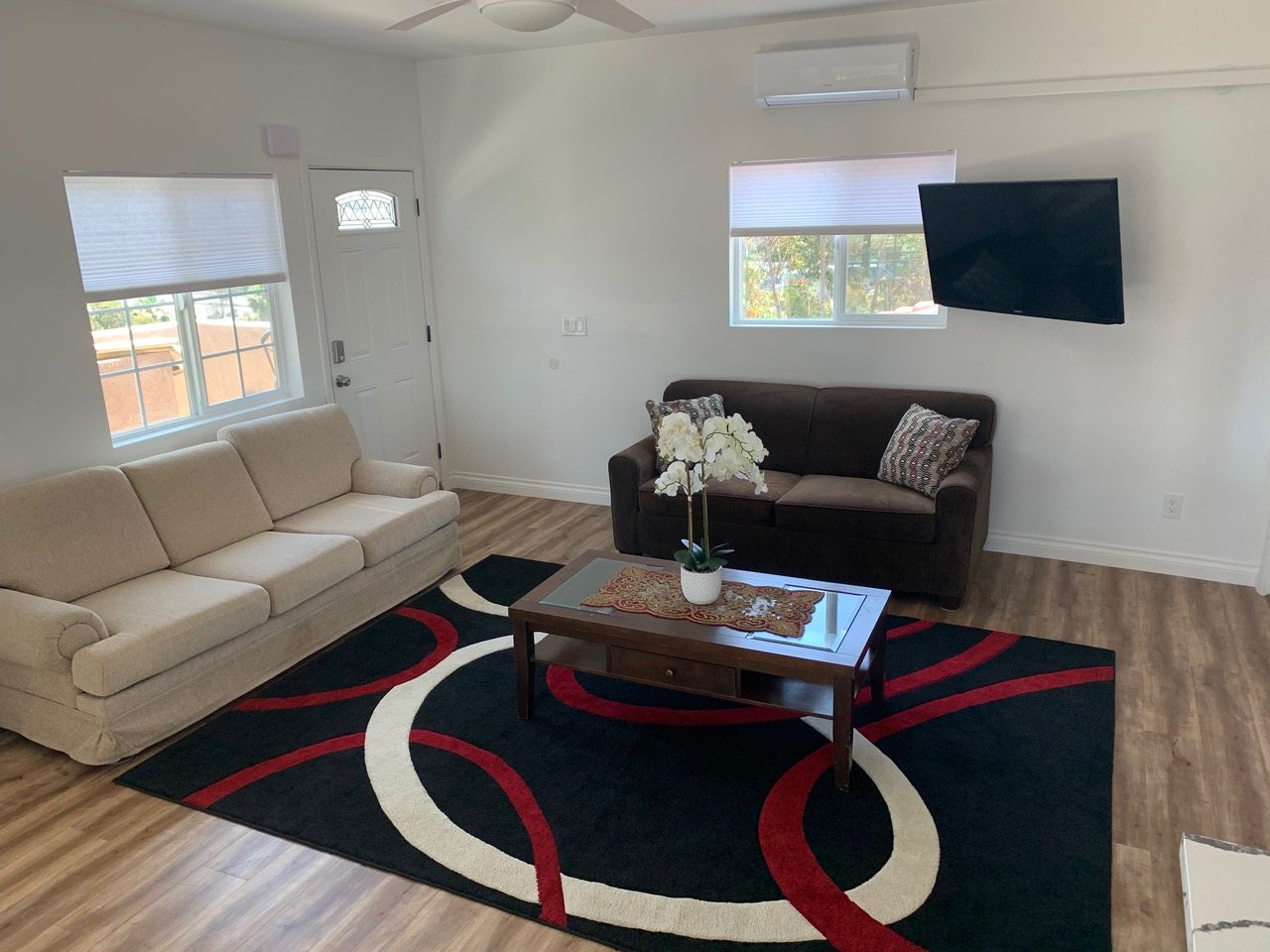Finished living room with wood-look flooring